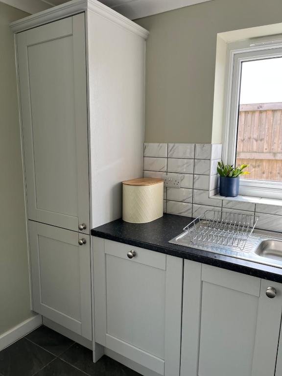 Bluehouse Drive kitchen storage and sink